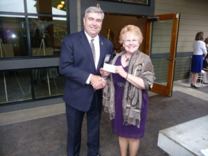 Chapter Presdient, Evelyn Brady, presents a $6000 check to Bob Knight for our chapter endowment at Clark College, May 18, 2016 at the Savoring Excellence Dinner