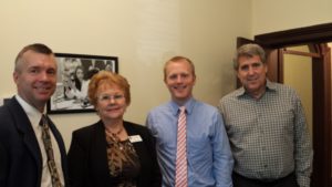 L-R: 1VP Jeremy Baenen and President Evelyn Brady, pose with Jonathan Egan and Dale Lewis on Congresswoman Herrera Beutler's Staff